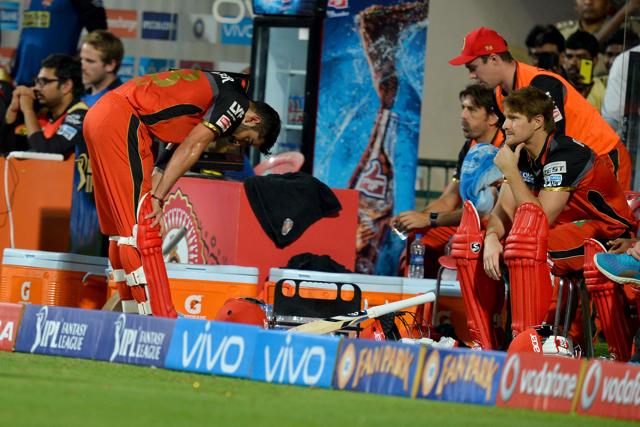 Royal Challengers Bangalore captain and batsman Virat Kohli bends down with disappointment in the players dug out after being bowled out during the final Twenty20 cricket match of the 2016 Indian Premier League (IPL). (AFP) Royal Challengers Bangalore captain and batsman Virat Kohli bends down with disappointment in the players dug out after being bowled out during the final Twenty20 cricket match of the 2016 Indian Premier League (IPL). (AFP)