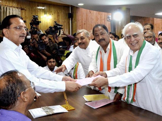 Congress candidate Kapil Sibal files nomination papers for Rajya Sabha elections at Vidhan Bhawan in Lucknow on Monday. (PTI Photo) Congress candidate Kapil Sibal files nomination papers for Rajya Sabha elections at Vidhan Bhawan in Lucknow on Monday. (PTI Photo)