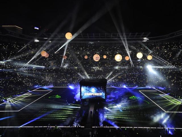 Spectators watch a light show during Real Madrid celebrations for their 11th Uefa Champions Cup at the Santiago Bernabeu stadium in Madrid. (AFP Photo)