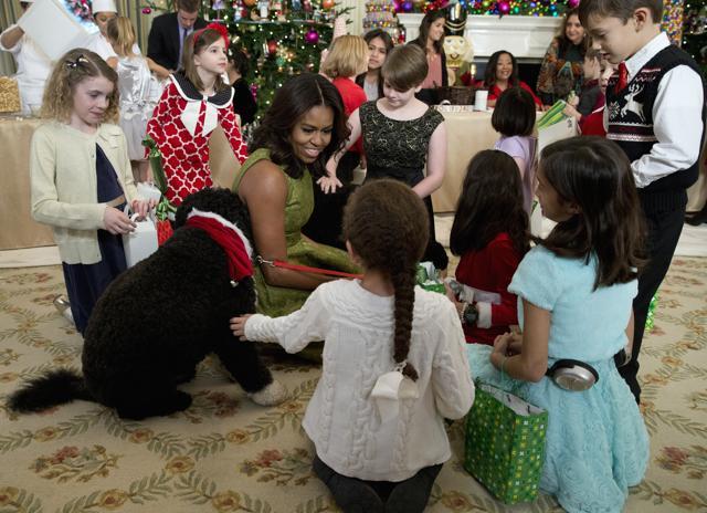 First Lady Michelle Obama with Bo, surrounded by children in the State Dining room of the White House in Washington. (AP Photo) First Lady Michelle Obama with Bo, surrounded by children in the State Dining room of the White House in Washington. (AP Photo)