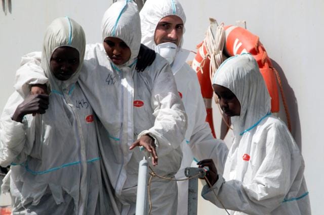 Migrants disembark from the Italian Navy vessel Vega at the Reggio Calabria harbour, southern Italy. (REUTERS) Migrants disembark from the Italian Navy vessel Vega at the Reggio Calabria harbour, southern Italy. (REUTERS)