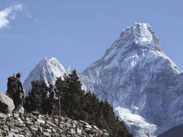 Trekkers make their way to Dingboche, a popular Mount Everest base camp, in Pangboche, Nepal. Rescuers have abandoned plans to retrieve the bodies of two Indian climbers missing on Mount Everest. (AP File Photo) Trekkers make their way to Dingboche, a popular Mount Everest base camp, in Pangboche, Nepal. Rescuers have abandoned plans to retrieve the bodies of two Indian climbers missing on Mount Everest. (AP File Photo)