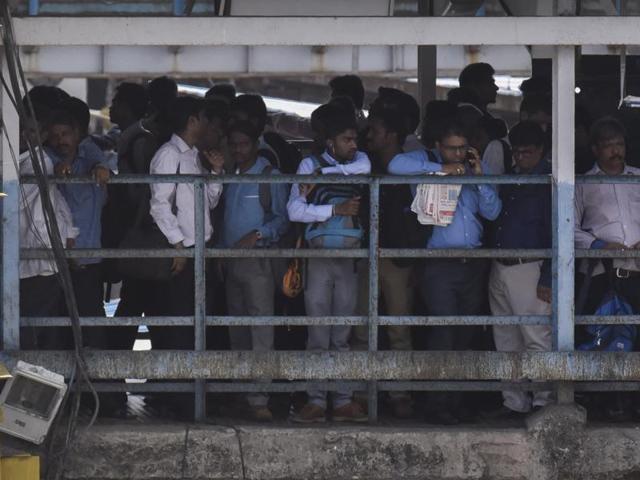 People wait for trains at Dadar station on Tuesday (Hindustan Times)