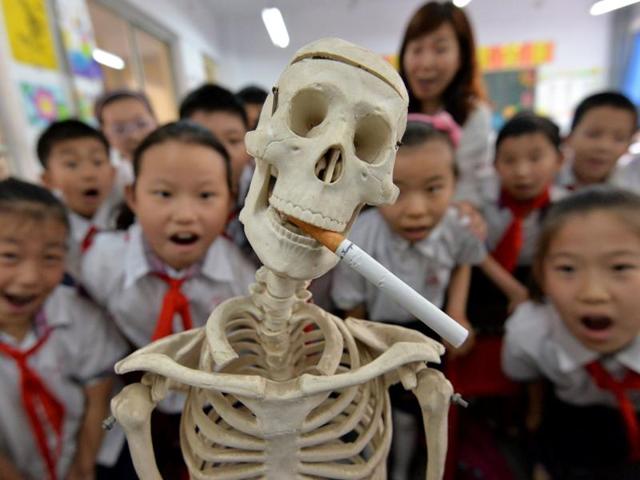 Students participating in the World No Tobacco Day campaign at a primary school in Handan, northern China's Hebei province. The slumping output of tobacco products in China is one of the factors responsible for the country's lowest industrial production rate in the first two months of the year since the global financial crisis. (AFP) Students participating in the World No Tobacco Day campaign at a primary school in Handan, northern China's Hebei province. The slumping output of tobacco products in China is one of the factors responsible for the country's lowest industrial production rate in the first two months of the year since the global financial crisis. (AFP)