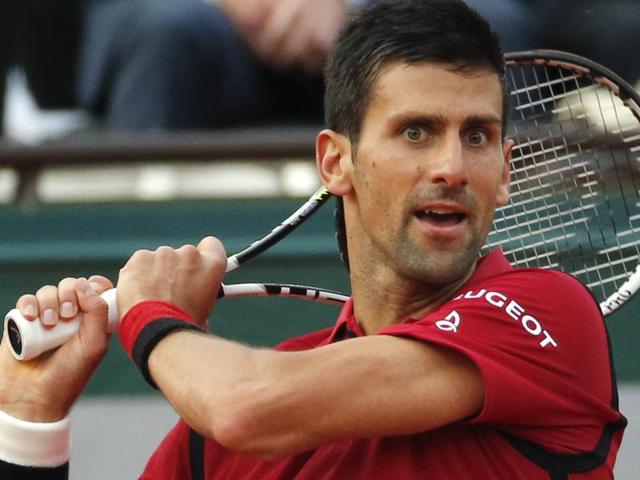 Serbia's Novak Djokovic returns in the third round match of the French Open tennis tournament. (AP Photo) Serbia's Novak Djokovic returns in the third round match of the French Open tennis tournament. (AP Photo)