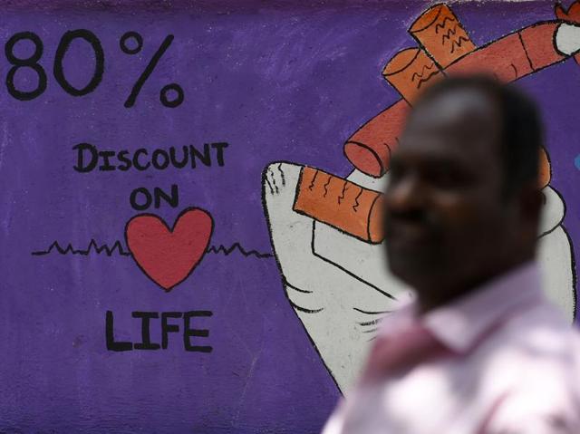 An anti-smoking graffiti on a wall in Mumbai. Many countries are considering following the example of Australia and introducing 'plain packaging' of cigarettes with graphic health warnings which are said to discourage people from smoking. (AFP) An anti-smoking graffiti on a wall in Mumbai. Many countries are considering following the example of Australia and introducing 'plain packaging' of cigarettes with graphic health warnings which are said to discourage people from smoking. (AFP)