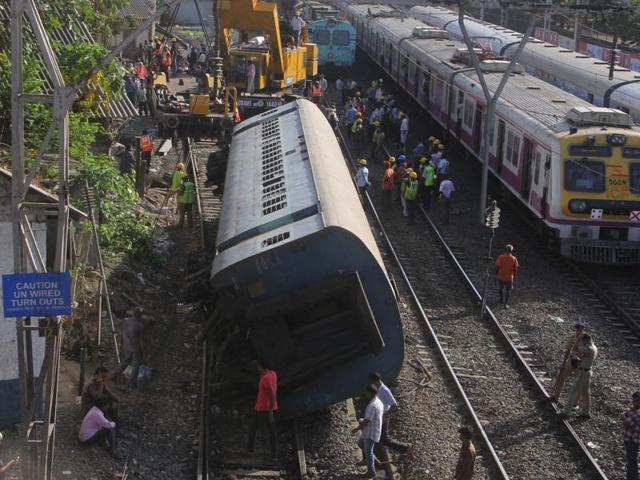 Stranded local trains wait for the removal of the coach