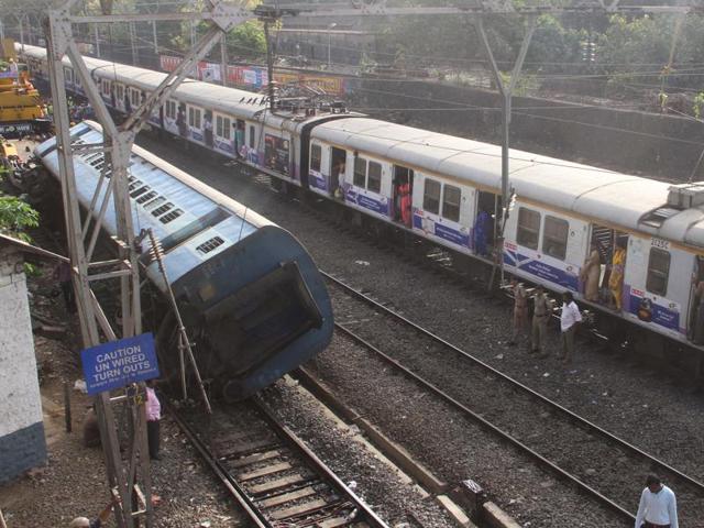 An empty coach of a long-distance train derailed near Lower Parel station throwing suburban lifeline out of gear in the first half of the day on Tuesday, May 31, 2016. (Bhushan Koyande)