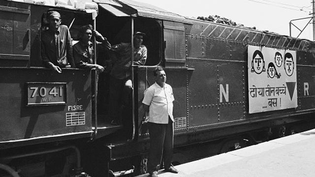Punjab Mail was a popular advertising vehicle as well for family planning. Here, in this picture from September 16, 1968, it carries the message ‘Two or Three Children, No More’. The birth control signs on locomotives of several trains carried the red triangle-symbol of family planning in India. At the time, India's population was 550 million (55 crore), and was increasing by nearly 10 million (1 crore) every year. It stands close to 1.5 billion (150 crore) now. (Bettmann Archive/Getty Images)