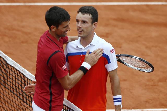 Djokovic and Bautista Agut at the net after the match. (REUTERS) Djokovic and Bautista Agut at the net after the match. (REUTERS)