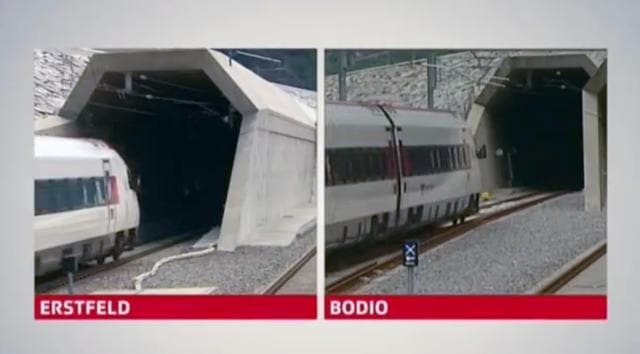 Video grab taken from SRG footage, shows a split screen displaying VIP trains entering the northern end of the tunnel in Erstfield and southern side of the tunnel in Bodio, during the opening ceremony of the NEAT Gotthard Base Tunnel. (REUTERS)