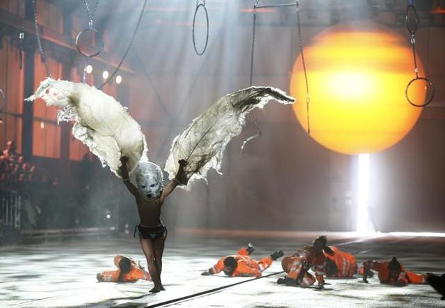 A performer dressed as a bird takes part in a show during the opening ceremony of the NEAT Gotthard Base Tunnel. (Reuters)