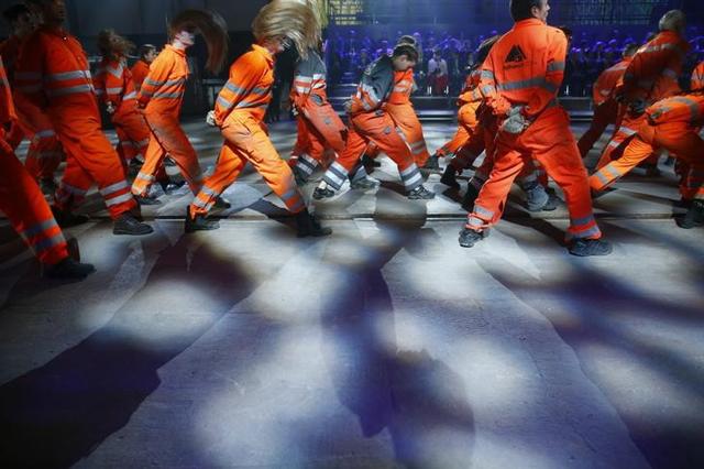 Performers dressed as miners, take part in a show during the opening ceremony of the NEAT Gotthard Base Tunnel. (Reuters)