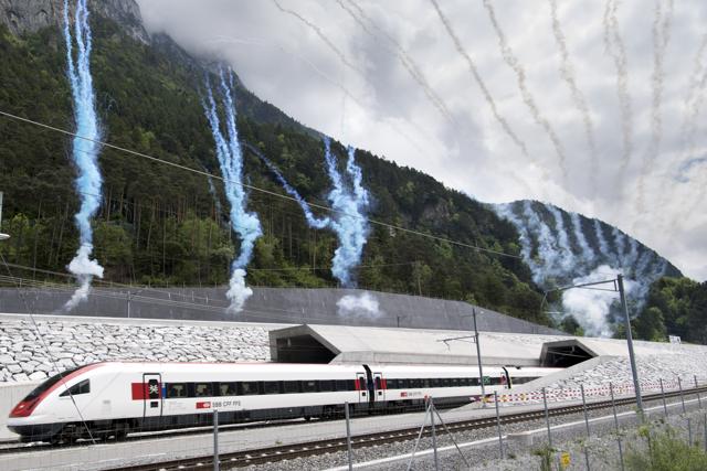 The first train comes out of the tunnel's North portal on the opening day of the Gotthard rail tunnel. (AP)