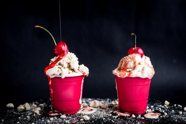 Ice Cream Sundae with crushed coffee meringue and strawberry sauce Ice Cream Sundae with crushed coffee meringue and strawberry sauce