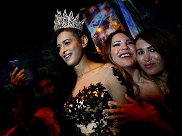 Rosalinda Peres poses with her friends after winning the title. (REUTERS) 