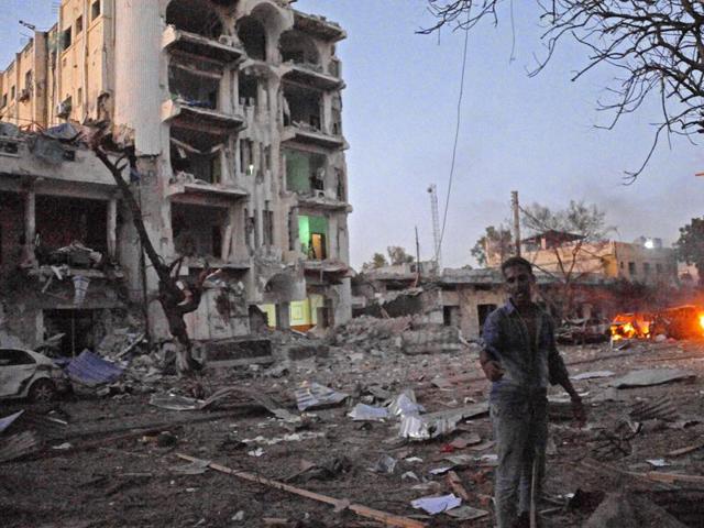 A man stands next to the Ambassador Hotel, after Somalia's al Qaeda-linked Shabaab on June 1, 2016, launched a deadly attack on a top Mogadishu hotel.(AFP)