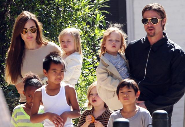Angelina Jolie, Brad Pitt and their children. Angelina Jolie, Brad Pitt and their children.