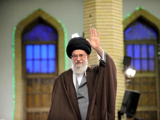 Iran's supreme leader Ayatollah Ali Khamenei waves as he arrives to address workers in Tehran.(Reuters)