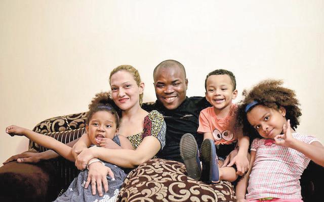 Nigerian citizen Ennamuel Ekufu with his Indian wife and children at his residence in Greater Noida. (Ravi Choudhar/HT Photo)