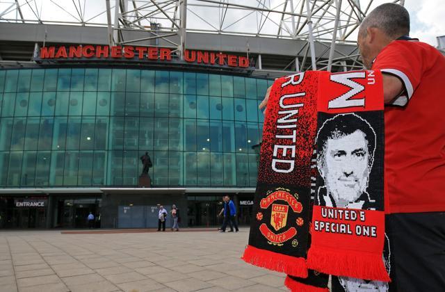 Scarves featuring the image of Manchester United's new Portuguese manager Jose Mourinho are displayed for sale outside the club's Old Trafford football stadium in Manchester. (AFP Photo) Scarves featuring the image of Manchester United's new Portuguese manager Jose Mourinho are displayed for sale outside the club's Old Trafford football stadium in Manchester. (AFP Photo)
