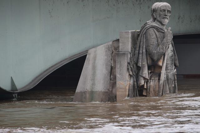 A photo taken on Friday shows waters of the river Seine rising on the statue of the Zouave at the Alma bridge in Paris. (AFP)