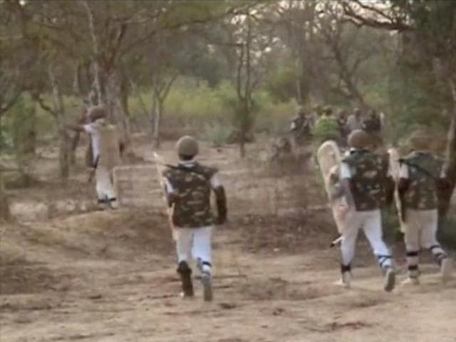 An image made from video shows paramilitary soldiers charging at protesters near the site of violent clashes in Mathura on June 2, 2016. (AP)