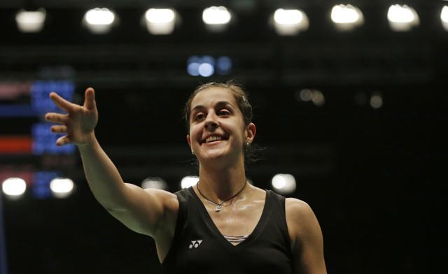Spain's Carolina Marin celebrates after beating Saina Nehwal during the quarterfinals women's single match at the Indonesia Open badminton tournament. (AP Photo) Spain's Carolina Marin celebrates after beating Saina Nehwal during the quarterfinals women's single match at the Indonesia Open badminton tournament. (AP Photo)