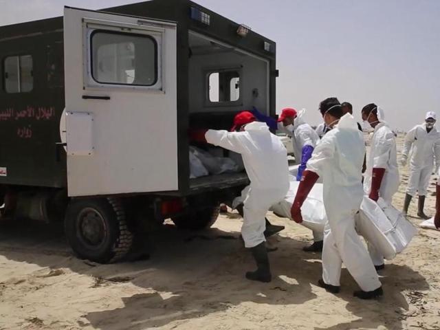 Emergency services remove the body of a victim as more than 100 bodies are pulled from the sea near the western city of Zwara in Libya on Friday after a smuggling boat carrying mainly African migrants sank into the Mediterranean. (AP) Emergency services remove the body of a victim as more than 100 bodies are pulled from the sea near the western city of Zwara in Libya on Friday after a smuggling boat carrying mainly African migrants sank into the Mediterranean. (AP)