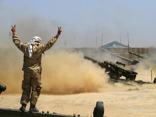 Iraqi security forces and allied Popular Mobilization forces fire artillery during fight against Islamic State militants in Fallujah, Iraq. (AP file photo) Iraqi security forces and allied Popular Mobilization forces fire artillery during fight against Islamic State militants in Fallujah, Iraq. (AP file photo)
