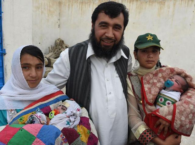 In this photograph taken on March 23, 2016, Pakistani man Sardar Haji Jan Mohammad Khilji poses with some of his children at his residence in Quetta. (AFP) In this photograph taken on March 23, 2016, Pakistani man Sardar Haji Jan Mohammad Khilji poses with some of his children at his residence in Quetta. (AFP)