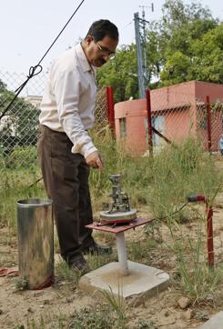A manual cylindrical rain gauge vessel helps measure the amount of rainfall at IMD. (Sanchit Khanna / HT Photos) A manual cylindrical rain gauge vessel helps measure the amount of rainfall at IMD. (Sanchit Khanna / HT Photos)