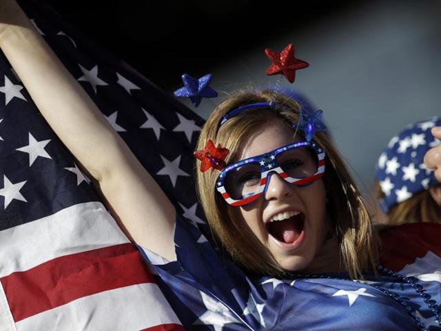 A fan of the US football team holds a flag before a Copa America Centenario. (AP Photo) A fan of the US football team holds a flag before a Copa America Centenario. (AP Photo)