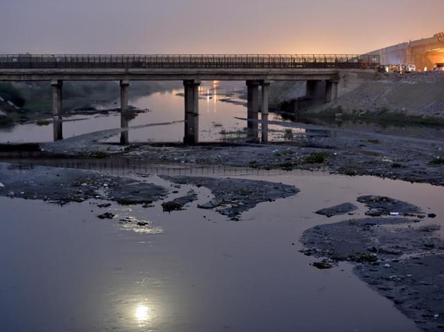 The Najafgarh drain, carrying the sewer waste of Delhi, makes its way to the River Yamuna, near the Bhalswa garbage dump. (Gurinder Osan/HT Photo) The Najafgarh drain, carrying the sewer waste of Delhi, makes its way to the River Yamuna, near the Bhalswa garbage dump. (Gurinder Osan/HT Photo)