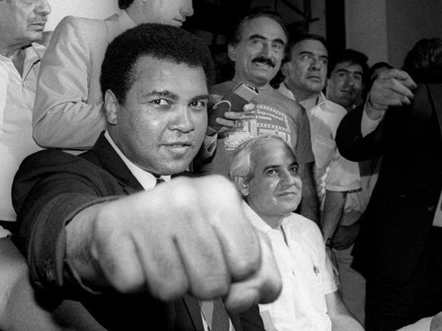 A smiling Muhammad Ali shows his fist to reporters during an impromptu news conference in Mexico City. (Reuters Photo) A smiling Muhammad Ali shows his fist to reporters during an impromptu news conference in Mexico City. (Reuters Photo)