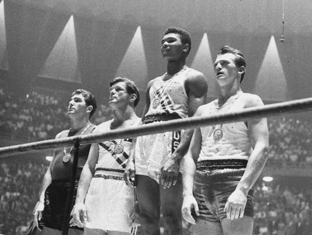 The winners of the 1960 Olympic medals for light heavyweight boxing on the winners' podium. (Getty Images) The winners of the 1960 Olympic medals for light heavyweight boxing on the winners' podium. (Getty Images)