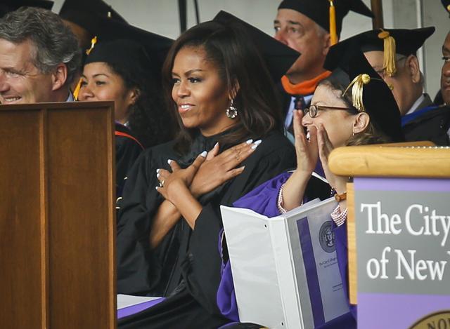 First lady Michelle Obama reacts to cheers from the class of 2016, during commencement for City College of New York on Friday. (AP) First lady Michelle Obama reacts to cheers from the class of 2016, during commencement for City College of New York on Friday. (AP)