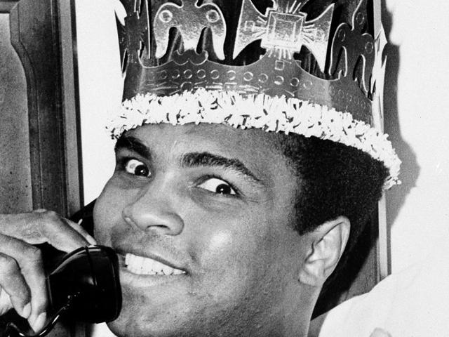 Muhammad Ali speaks on the phone while wearing a king's crown in Miami Beach. (AP photo) Muhammad Ali speaks on the phone while wearing a king's crown in Miami Beach. (AP photo)