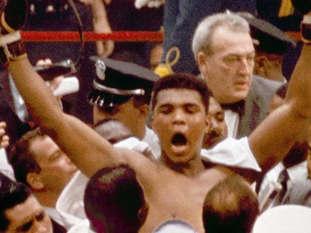 Muhammad Ali, or Cassius Clay at the time, strikes a familiar pose as he shouts "I am the greatest," as he leaves the ring, arms raised, following his defeat of Sonny Liston. (AP Photo) Muhammad Ali, or Cassius Clay at the time, strikes a familiar pose as he shouts "I am the greatest," as he leaves the ring, arms raised, following his defeat of Sonny Liston. (AP Photo)