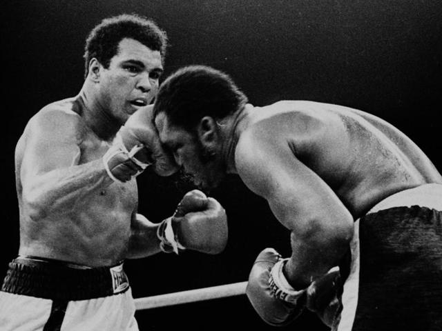 In this Oct. 1, 1975, file photo, spray flies from the head of challenger Joe Frazier as heavyweight champion Muhammad Ali connects with a right in the ninth round of their title fight in Manila, Philippines. (AP) In this Oct. 1, 1975, file photo, spray flies from the head of challenger Joe Frazier as heavyweight champion Muhammad Ali connects with a right in the ninth round of their title fight in Manila, Philippines. (AP)