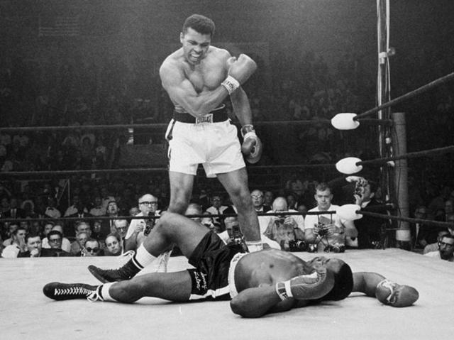 In this May 25, 1965, file photo, heavyweight champion Muhammad Ali, then known as Cassius Clay, stands over challenger Sonny Liston. (AP Photo) In this May 25, 1965, file photo, heavyweight champion Muhammad Ali, then known as Cassius Clay, stands over challenger Sonny Liston. (AP Photo)