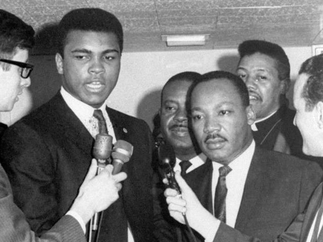 In this March 29, 1967, file photo, heavyweight champion Muhammad Ali, center left, and Dr. Martin Luther King speak to reporters. (AP Photo) In this March 29, 1967, file photo, heavyweight champion Muhammad Ali, center left, and Dr. Martin Luther King speak to reporters. (AP Photo)