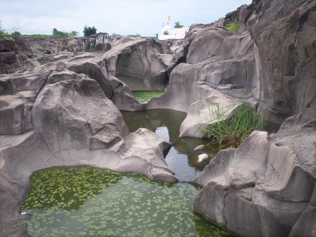 You can walk through river-made craters that run 40 feet deep in Nighoj. You can walk through river-made craters that run 40 feet deep in Nighoj.