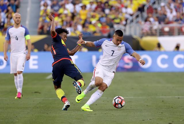Bobby Wood of United States and Juan Cuadrado of Colombia go for the ball during the 2016 Copa America Centenario Group match. (AFP Photo) Bobby Wood of United States and Juan Cuadrado of Colombia go for the ball during the 2016 Copa America Centenario Group match. (AFP Photo)