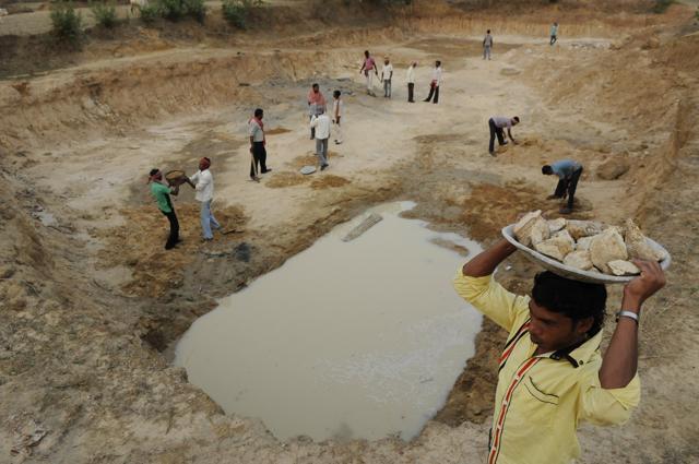 Villagers of Uka at Raghunathpur-II block in Purulia district dig a catchment area for rainwater harvesting. (Samir Jana/HT Photo) Villagers of Uka at Raghunathpur-II block in Purulia district dig a catchment area for rainwater harvesting. (Samir Jana/HT Photo)