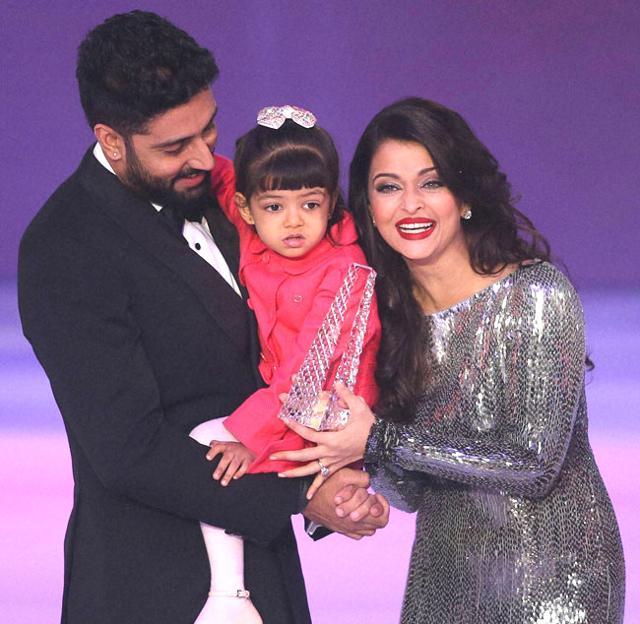 Abhishek and Aishwarya rejoice as they pose with daughter Aaradhya. Abhishek and Aishwarya rejoice as they pose with daughter Aaradhya.