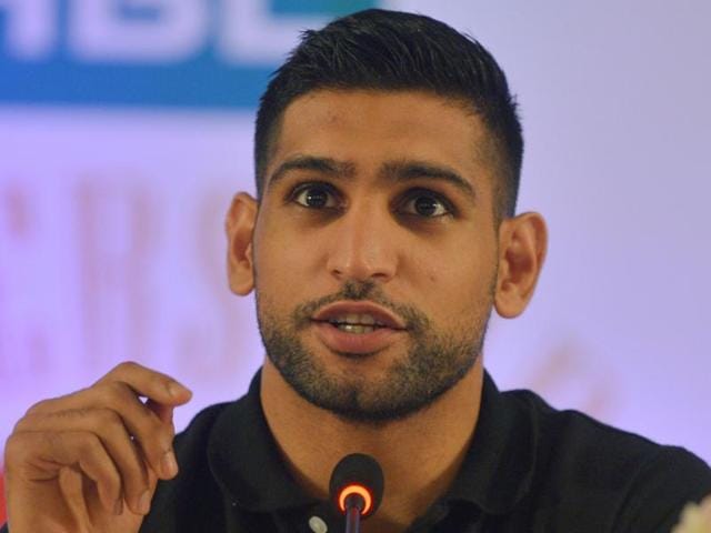 British boxer Amir Khan addresses a press conference in the Pakistani city of Karachi. (AFP Photo) British boxer Amir Khan addresses a press conference in the Pakistani city of Karachi. (AFP Photo)