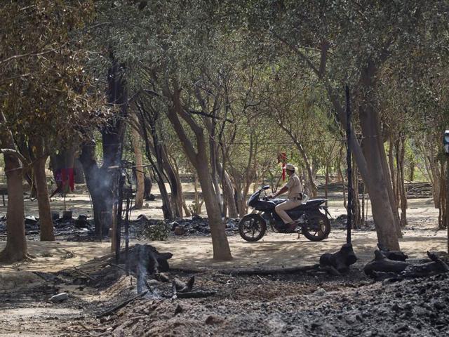Superintendent of Police (city) Mukul Dwivedi was deserted by his fellow policemen as he advanced towards the Jawahar Bagh premises on Thursday evening. (AP) Superintendent of Police (city) Mukul Dwivedi was deserted by his fellow policemen as he advanced towards the Jawahar Bagh premises on Thursday evening. (AP)