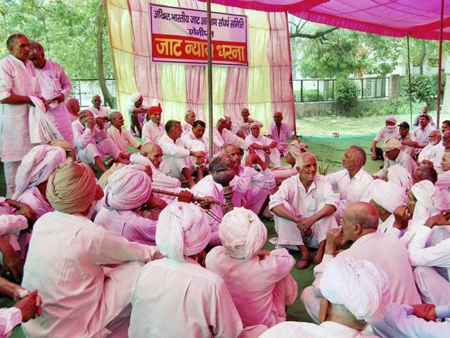 Jat members holding a dharna for reservation in Sonipat on Sunday, June 5, 2016. (PTI) Jat members holding a dharna for reservation in Sonipat on Sunday, June 5, 2016. (PTI)