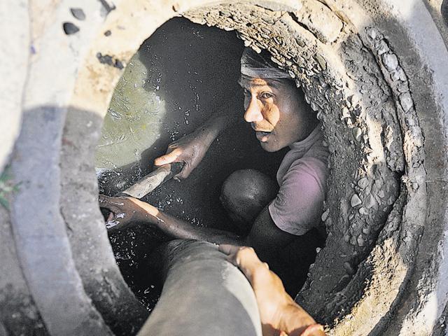 A uniform, gas mask, protective jacket, and proper tools will make them stand out; and everyone else will think Swachh Bharat is only those guys’ duty. In a democracy, that is just not done.(Gurminder Singh/HT Photo) A uniform, gas mask, protective jacket, and proper tools will make them stand out; and everyone else will think Swachh Bharat is only those guys’ duty. In a democracy, that is just not done.(Gurminder Singh/HT Photo)